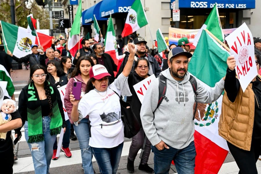 A group of supporters of Mexican President Andres Manuel Lopez Obrador march along Market street on Thursday, Nov. 16, 2023, in San Francisco. (AP Photo/Noah Berger)