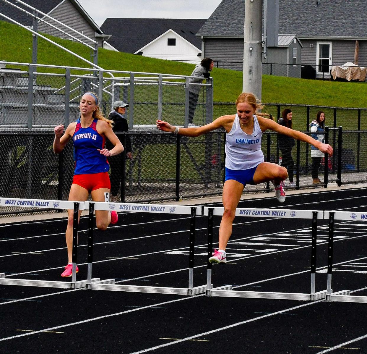 Van Meter's Madi Boese competes in the 400-meter hurdles during the West Central Activities Conference meet.