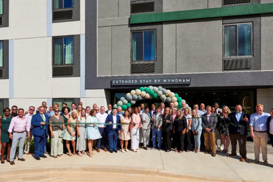 Wyndham executives and local officials celebrate the grand opening of the first ECHO Suites in Spartanburg, South Carolina, in July 2024. Wyndham Hotels & Resorts