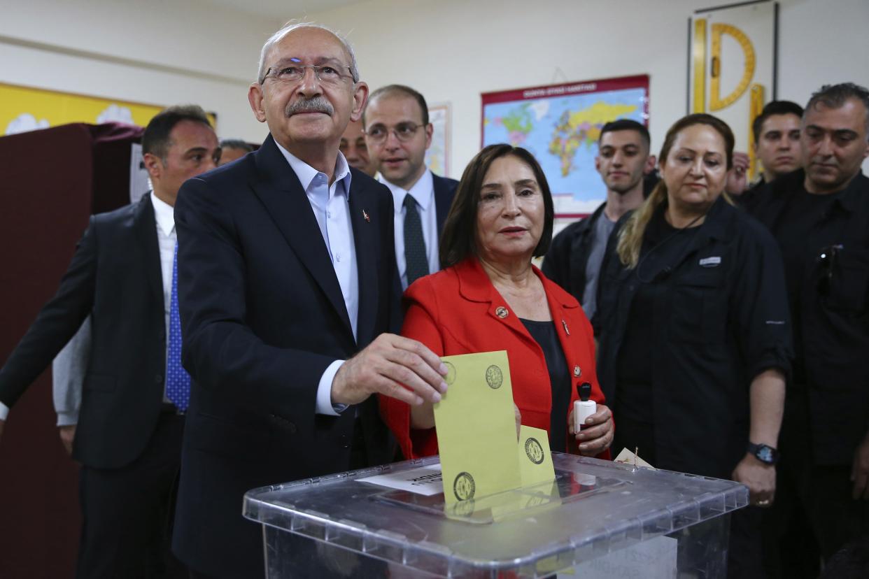 Turkish CHP party leader and Nation Alliance's presidential candidate Kemal Kilicdaroglu, and his wife Selvi Kilicdaroglu, vote at a polling station in Ankara, Turkey, Sunday, May 28, 2023. Voters in Turkey returned to the polls Sunday to decide whether the country's longtime leader stretches his increasingly authoritarian rule into a third decade, or is unseated by a challenger who has promised to restore a more democratic society. (AP Photo/Ali Unal)