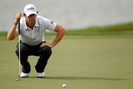PALM BEACH GARDENS, FL - MARCH 01: Rory McIlroy of Northern Ireland lines up a putt on the 17th hole during the first round of the Honda Classic at PGA National on March 1, 2012 in Palm Beach Gardens, Florida. (Photo by Mike Ehrmann/Getty Images)