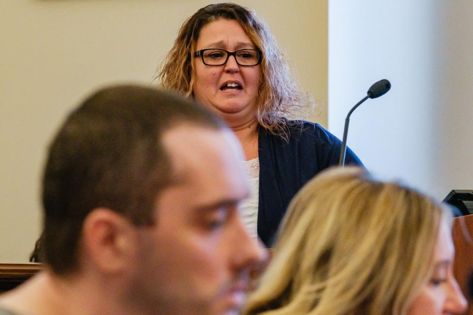 Tabitha Spaar, a cousin of Nathan S. Green, makes a statement during the change of plea hearing and sentencing of Corey Harshey, foreground, Tuesday, Oct. 24. Harshey changed his plea from not guilty by reason of insanity to guilty, for the murder of Green, in which he stabbed him in the neck and head.