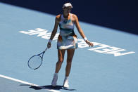 Garbine Muguruza of Spain reacts during her second round match against Alize Cornet of France at the Australian Open tennis championships in Melbourne, Australia, Thursday, Jan. 20, 2022. (AP Photo/Hamish Blair)