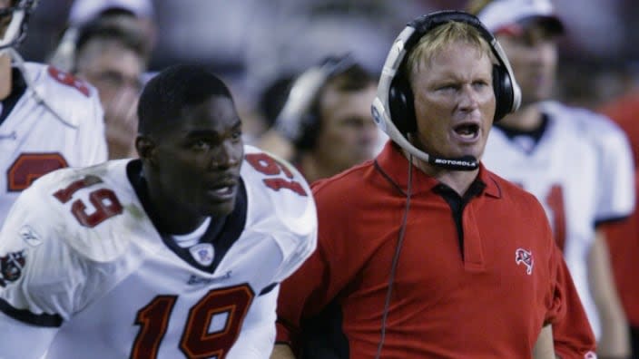 This Sept. 2002 shows Tampa Bay Buccaneers wide receiver Keyshawn Johnson (left) and Buccaneers’ head coach Jon Gruden during a NFL game against the St. Louis Rams at Raymond James Stadium in Tampa, Florida. (Photo: Andy Lyons/Getty Images)