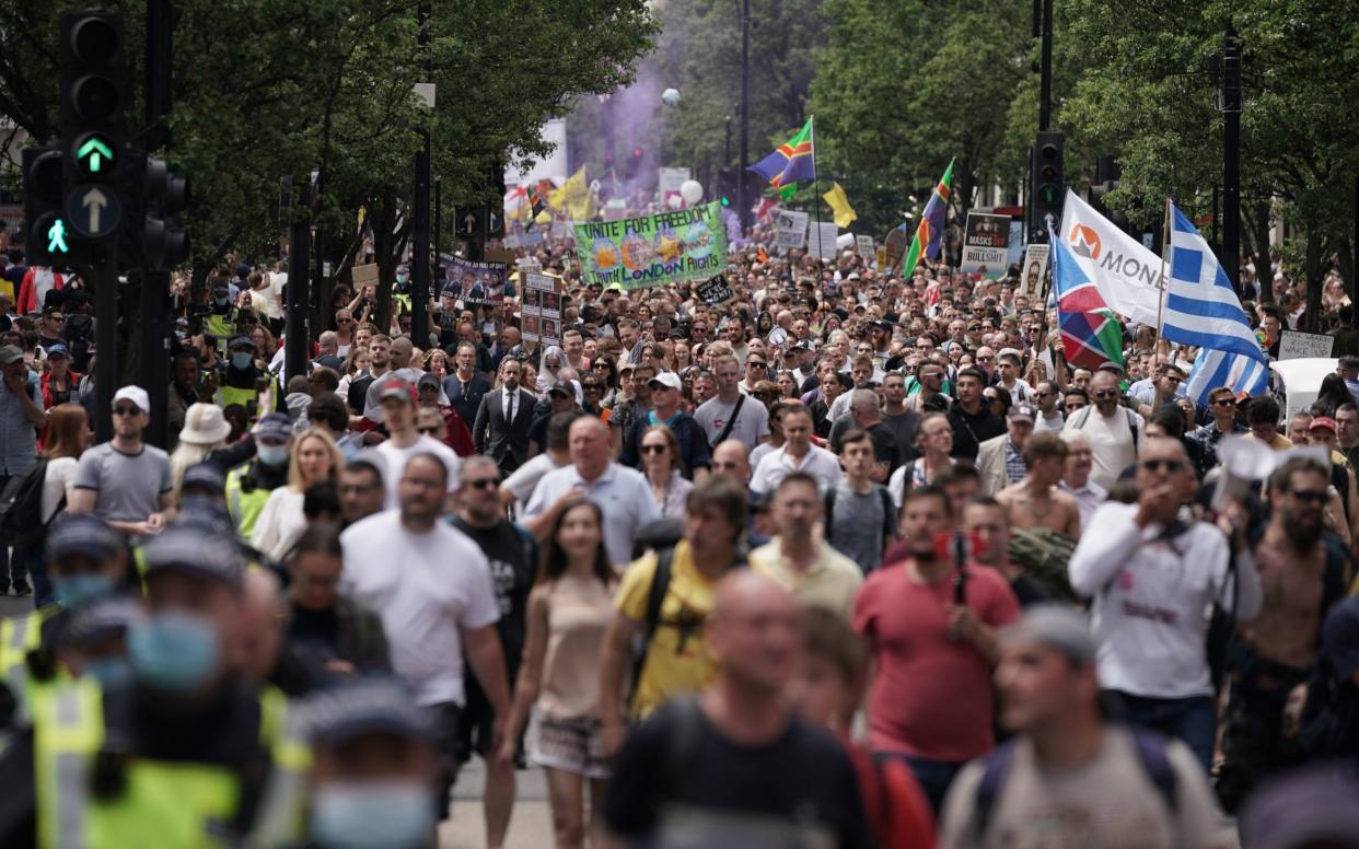 Anti-lockdown protesters march down Oxford Street on Saturday - Aaron Chown/PA Wire