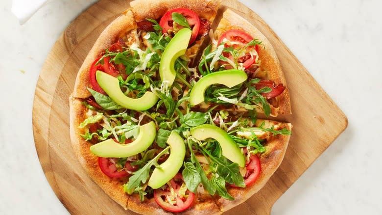 pizza with avocado and tomatoes