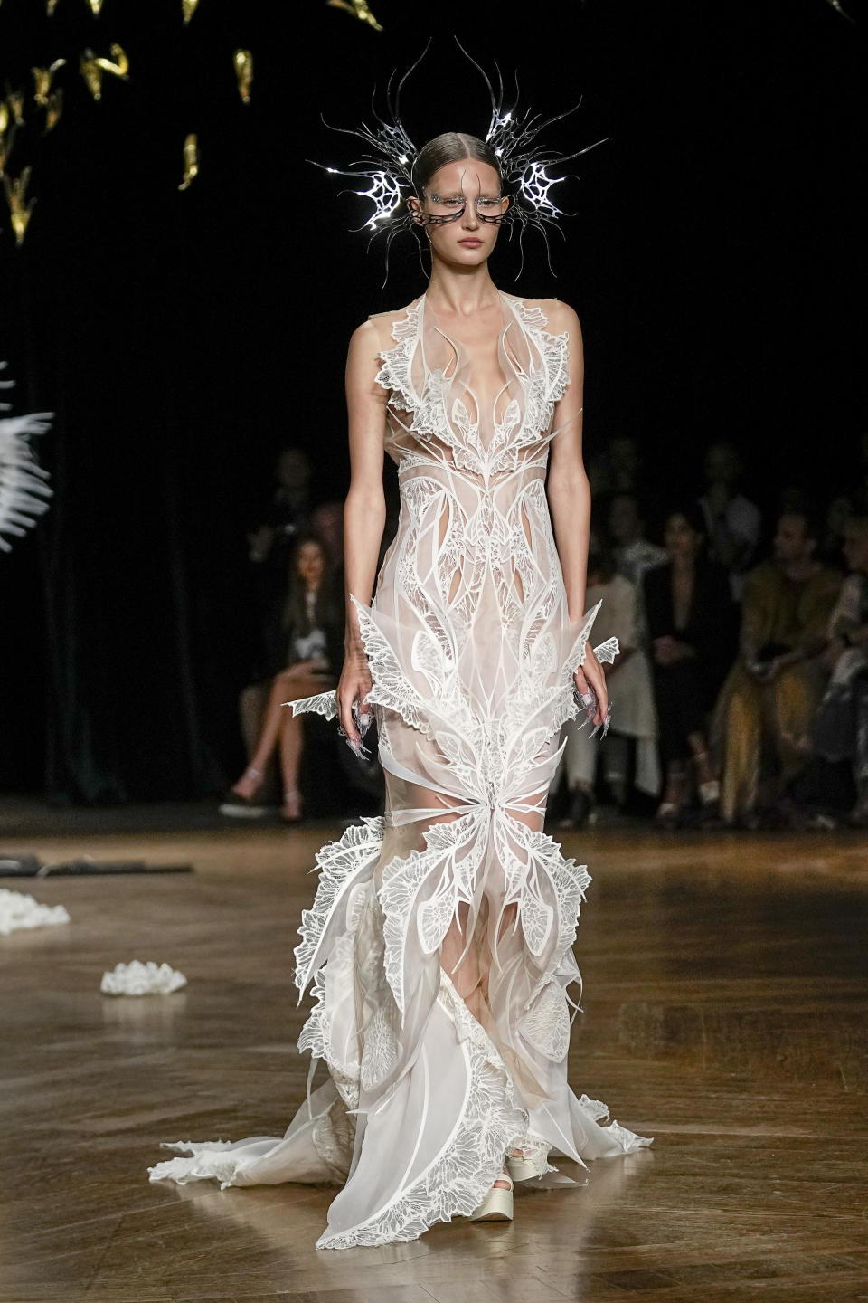 A model wears a creation as part of Iris van Herpen Haute Couture Fall/Winter 2022-2023 fashion collection presented Monday, July 4, 2022 in Paris. (AP Photo/Michel Euler)