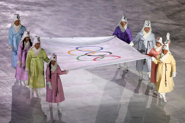 The Olympic flag is brought into the stadium during the Opening Ceremony. (Photo: Sean M. Haffey/Getty Images)