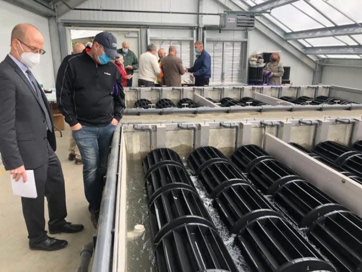 People tour the Algaewheel sewage treatment plant in Naples, New York, a few years ago. Mayor Brian Schenk said the village has seen a huge economic benefit from the system.