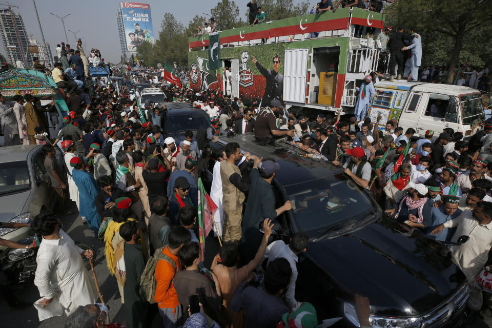 Supporters of Pakistan’s defiant former Prime Minister Imran Khan take part in an anti-government rally in Islamabad, Pakistan, Thursday, May 26, 2022. Khan early Thursday warned Pakistan's government to set new elections in the next six days or he will again march on the capital along with 3 million people. (AP Photo/Anjum Naveed)