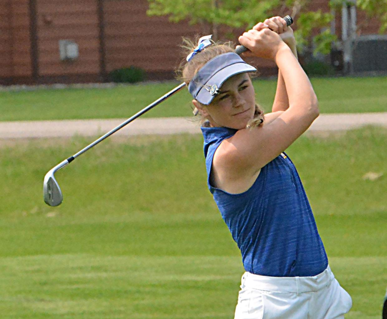 Aberdeen Central's Olivia Braun follows through on a practice swing on No. 9 Yellow during the Eastern South Dakota Conference girls golf tournament on Tuesday, May 23, 2023 at Cattail Crossing Golf Course in Watertown.