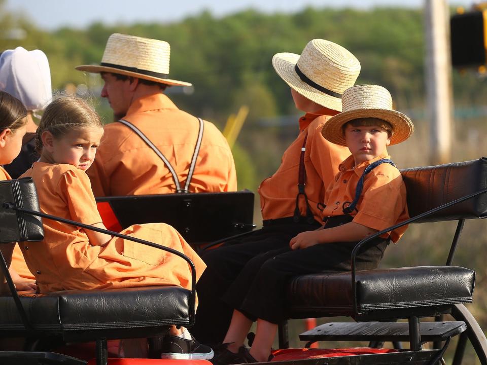 Amish children are seen on an amish horse in Central Pennsylvania, United States on April 30, 2017.