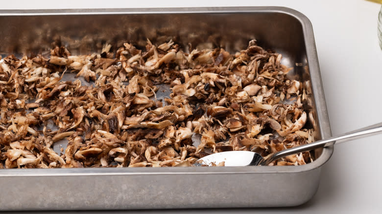 shredded mushrooms in oven tray