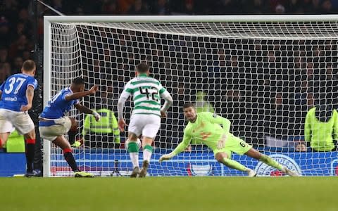 Fraser Forster of Celtic saves a penalty from Alfredo Morelos of Rangers - Credit: Michael Steele/Getty Images