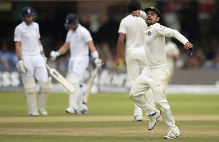 India's Virat Kohli reacts as England's Matt Prior (2nd L) is dismissed during the second cricket test match at Lord's cricket ground in London July 21, 2014. REUTERS/Philip Brown