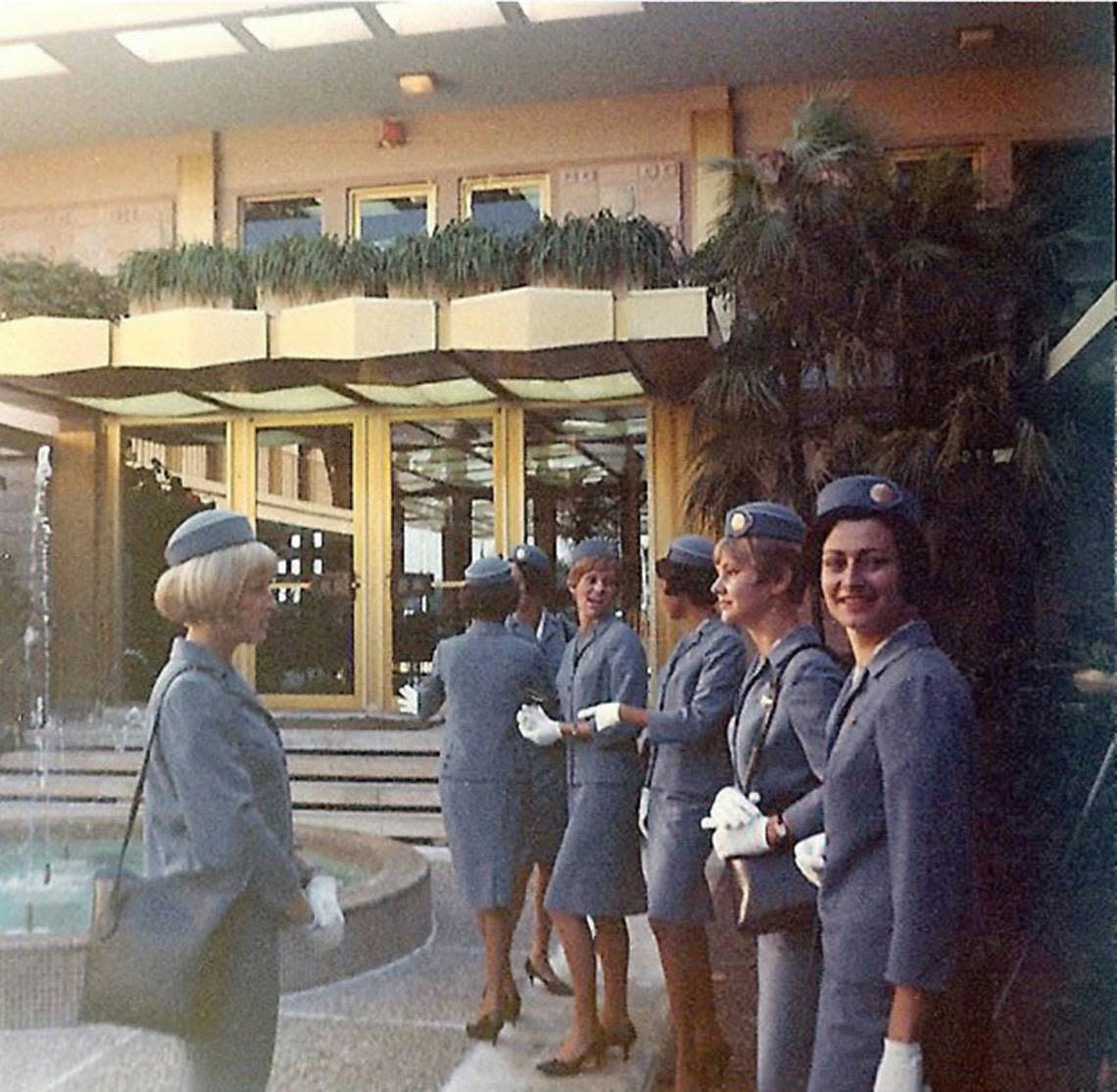 Flight attendants shown in 1968 at their graduation in the central courtyard of the Pan American Airways regional headquarters building at Miami International Airport.