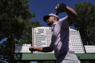 Bryson DeChambeau walks to the tee on the sixth hole during third round at the Masters golf tournament at Augusta National Golf Club Saturday, April 13, 2024, in Augusta, Ga. (AP Photo/Charlie Riedel)