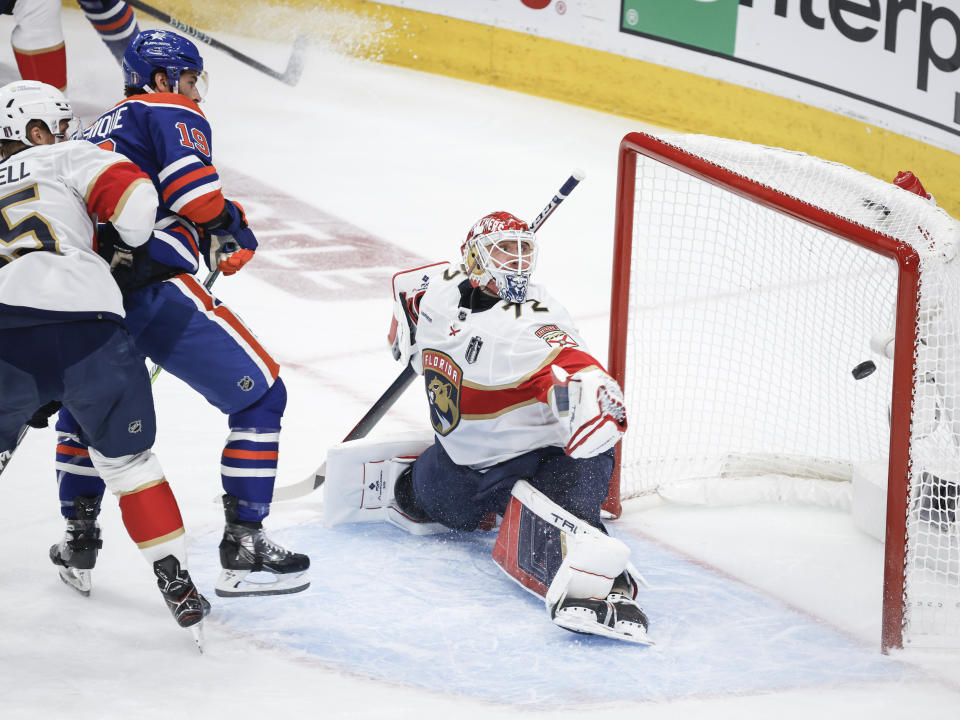 Florida Panthers goalie Sergei Bobrovsky (72) gives up a goal to Edmonton Oilers' Adam Henrique (19) during the first period of Game 4 of the NHL hockey Stanley Cup Final, Saturday, June 15, 2024, in Edmonton, Alberta. (Jeff McIntosh/The Canadian Press via AP)