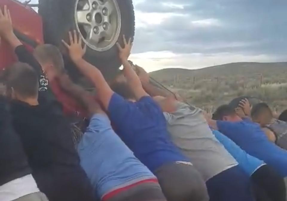 The Boise Black Knights youth football team stopped on an Oregon highway to rescue a couple who were trapped in an overturned car. (Facebook/Regan Magill)