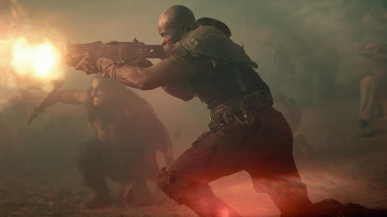  Djimon Hounsou's Titus firing rifle in Rebel Moon: Part Two. 