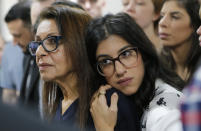 Israeli backpacker Naama Issachar's mother Yaffa Issachar, left, and sister Liad Goldberg wait to Issachar's appeal hearings in a courtroom in Moscow, Russia, Thursday, Dec. 19, 2019. Naama was sentenced in October to seven and a half years in prison for drug smuggling after authorities in April found nine grams of marijuana in her luggage. (AP Photo/Alexander Zemlianichenko Jr.)