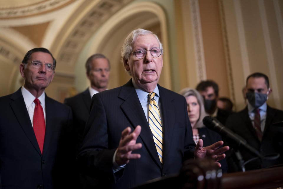 Senate Minority Leader Mitch McConnell, R-Ky., joined from left by Sen. John Barrasso, R-Wyo., and Minority Whip John Thune, R-S.D., speaks to reporters after a weekly GOP strategy meeting, at the Capitol in Washington, Tuesday, Sept. 21, 2021. (AP Photo/J. Scott Applewhite)