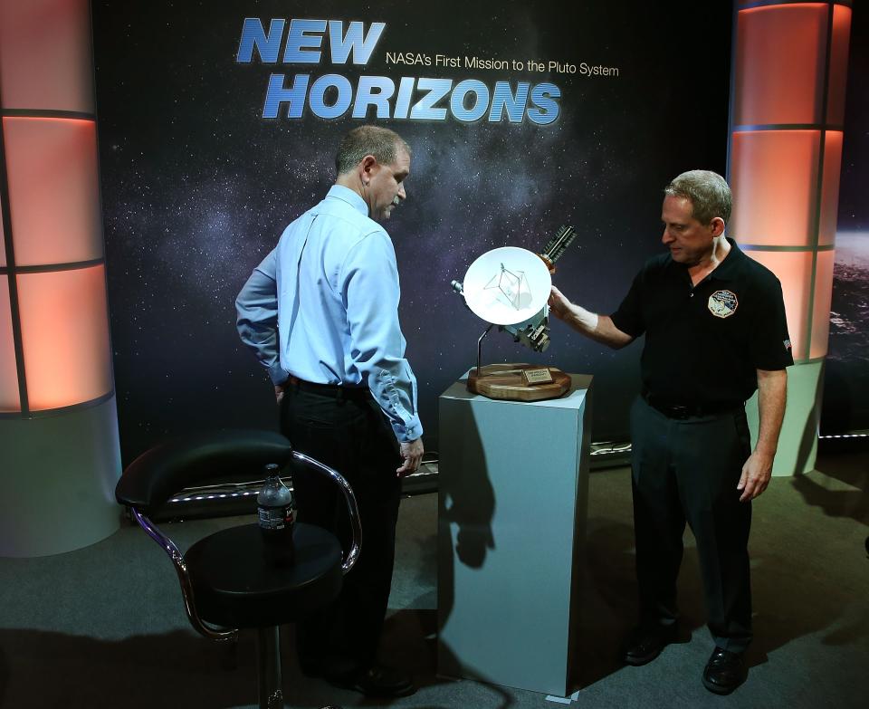 Principal Investigator Alan Stern (R) and scientist John Grunsfeld - Mark Wilson/Getty Images