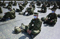 Members of Japanese Ground Self-Defense Force attend during an annual live firing exercise at Higashi Fuji range in Gotemba, southwest of Tokyo Saturday, May 23, 2020. (Charly Triballeau/Pool Photo via AP)