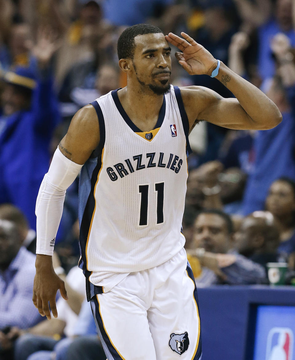 Memphis Grizzlies guard Mike Conley celebrates after scoring against the Oklahoma City Thunder in overtime of Game 3 of an opening-round NBA basketball playoff series Thursday, April 24, 2014, in Memphis, Tenn. The Grizzlies won 98-95. (AP Photo/Mark Humphrey)