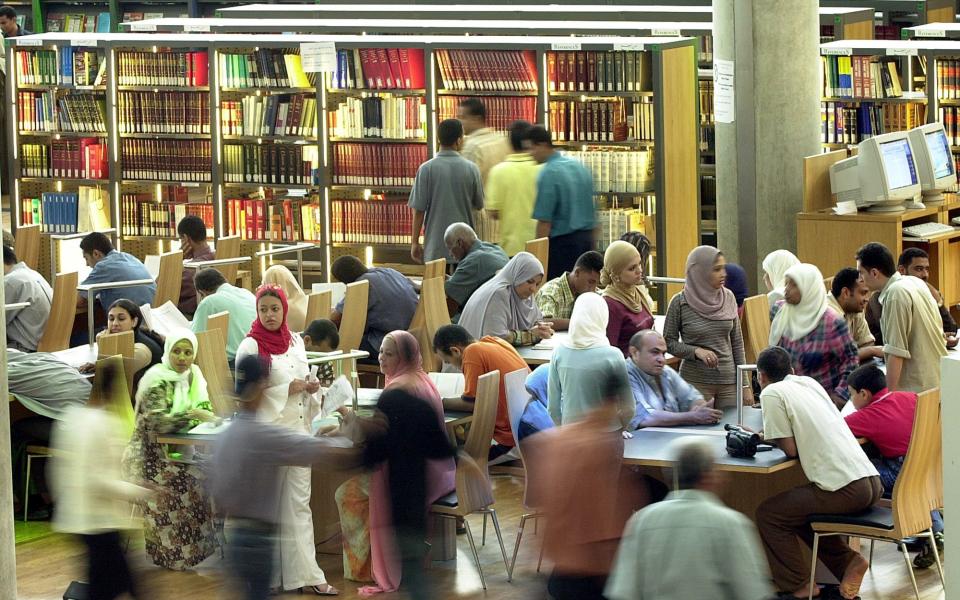 Then and now: visitors at the modern Library of Alexandria, Egypt - AP