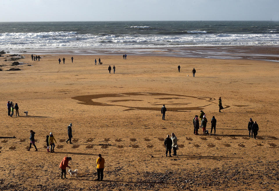 <p>A large-scale portrait of Major Charles Alan Smith Morris, the Bedfordshire Regiment, from Llandaff, Cardiff, who died aged 21 on 7 May 1917, on Freshwater West beach, Pembrokeshire. (REUTERS/Rebecca Nadem) </p>