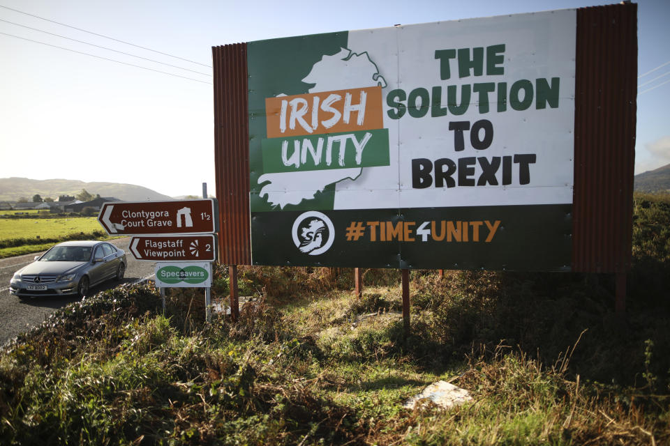 In this photo taken on Wednesday Oct. 16, 2019, motorists pass along the old Belfast to Dublin road close to the Irish border in Newry, Northern Ireland. Britain and the EU have pledged to keep the border open after Brexit, but they have struggled to find a solution that is acceptable to both sides. (Photo/Peter Morrison)