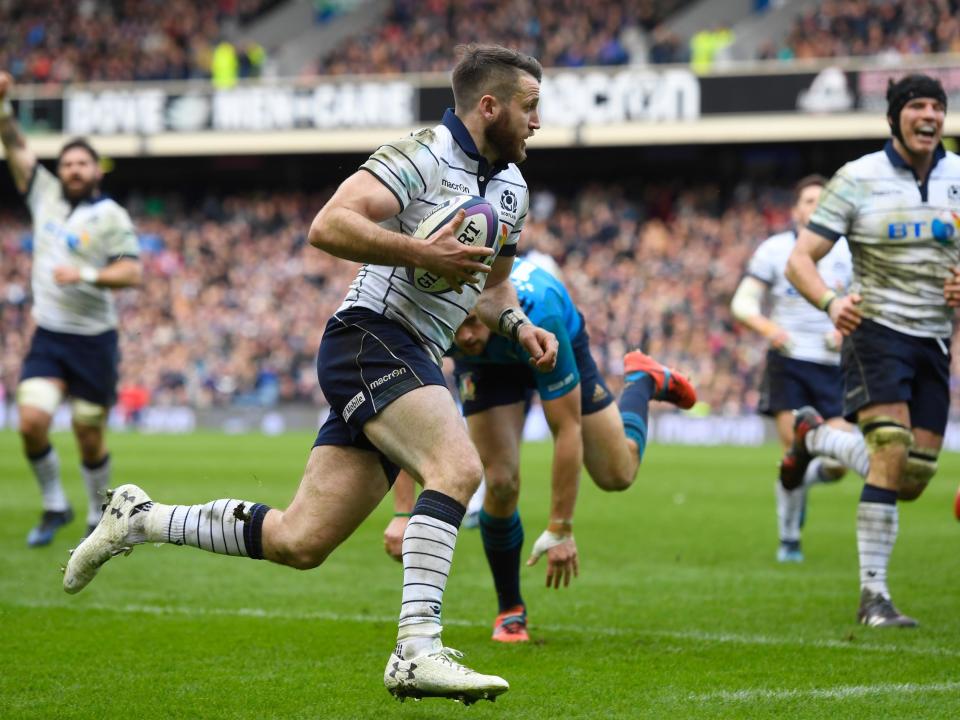 Tommy Seymour runs in for Scotland's fourth try: Getty