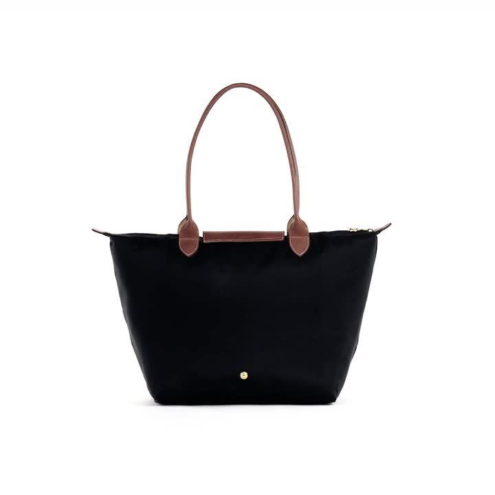 <p><a href="https://go.redirectingat.com?id=74968X1596630&url=https%3A%2F%2Fwww.longchamp.com%2Fus%2Fen%2Fproducts%2Ftote-bag-l-L1899089001.html&sref=https%3A%2F%2Fwww.townandcountrymag.com%2Fstyle%2Ffashion-trends%2Fg44576497%2Fbest-oversized-tote-bags%2F" rel="nofollow noopener" target="_blank" data-ylk="slk:Shop Now;elm:context_link;itc:0;sec:content-canvas" class="link rapid-noclick-resp">Shop Now</a></p><p>Le Pliage Original L Tote Bag</p><p>$155.00</p><p>longchamp.com</p>