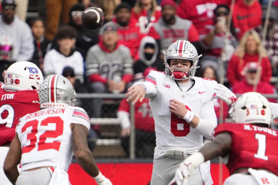 Nov 4, 2023; Piscataway, New Jersey, USA; Ohio State Buckeyes quarterback Kyle McCord (6) throws to running back TreVeyon Henderson (32) during the NCAA football game against the Rutgers Scarlet Knights at SHI Stadium. Ohio State won 35-16.