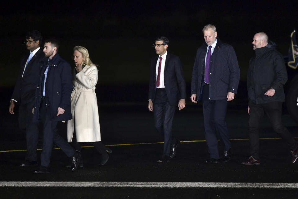 British Prime Minister Rishi Sunak, center, arrives at RAF Aldergrove Airbase on Tuesday, April 11, 2023, in Antrim, Northern Ireland. U.S. President Joe Biden is making a four-day visit to Northern Ireland and Ireland to coincide with the 25th Anniversary of the Good Friday Peace Agreement and to explore his Irish family heritage. (Charles McQuillan/Pool Photo via AP)