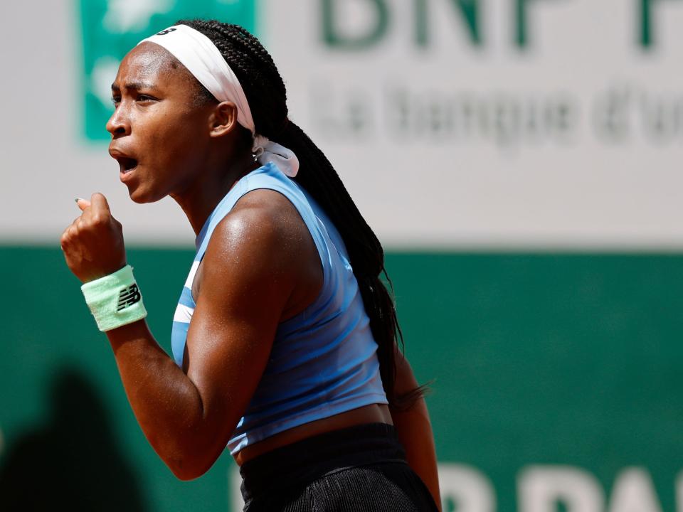 Coco Gauff celebrates during her opening match of the 2023 French Open.