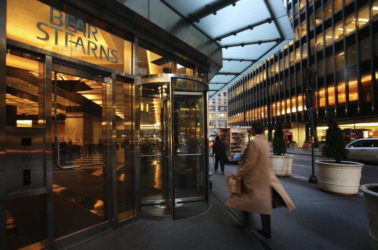 ** FILE ** In this March 17, 2008 file photo, an employee enters Bear Stearns in New York. Bear Stearns Cos. shareholders on Thursday, May 29, 2008 approved JPMorgan Chase & Co.'s $2.2 billion buyout of the investment bank whose wagers on subprime mortgages made it the largest corporate casualty of the global credit crisis. (AP Photo/Mark Lennihan, file)