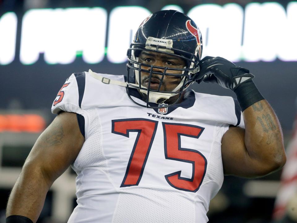 Vince Wilfork warms up before a game against the New England Patriots in