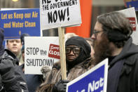 Government workers rally against the partial government shutdown at Federal Plaza, Thursday, Jan. 10, 2019, in Chicago. The partial government shutdown continues to drag on with hundreds of thousands of federal workers off the job or working without pay as the border wall fight persists. (AP Photo/Kiichiro Sato)