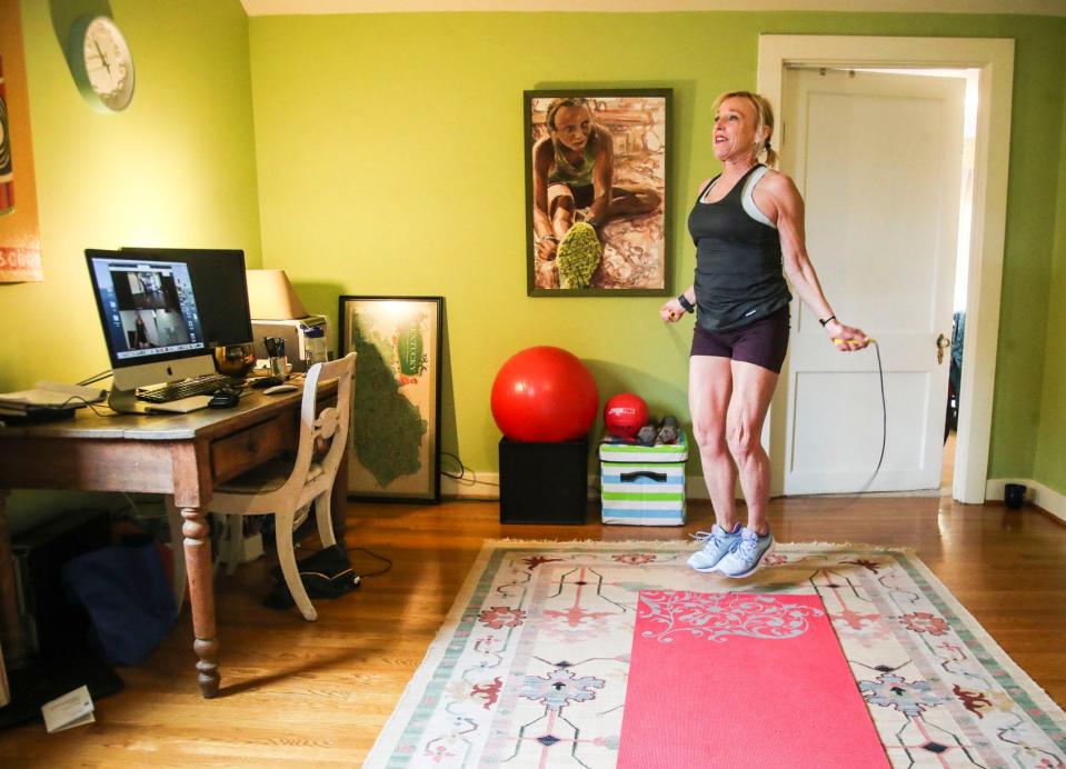 Kirby Adams works out at home during the coronavirus outbreak that has kept most of Kentuckians at home due to gyms being closed down currently. March 18, 2020.