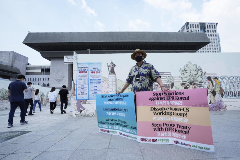 A protester stands to denounce policies of the United States on North Korea near the U.S. Embassy in Seoul, South Korea, Monday, June 21 2021. U.S. President Joe Biden's special envoy for North Korea said Monday he hopes to see a positive reaction from the North soon on U.S. offers for talks after the North Korean leader ordered officials to prepare for both dialogue and confrontation. (AP Photo/Ahn Young-joon)