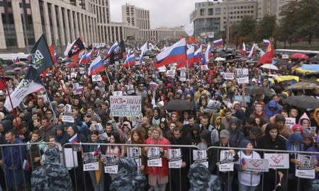 People attend a rally to demand authorities allow opposition candidates to run in a local election in Moscow