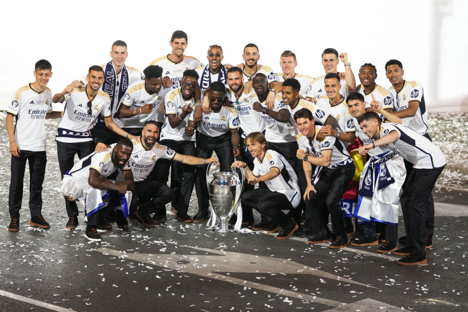 Real Madrid players celebrate during the Champions League trophy parade at the Cibeles square in Madrid, Spain, Sunday, June 2, 2024. Real Madrid won against Borussia Dortmund 2-0. (AP Photo/Bernat Armangue)