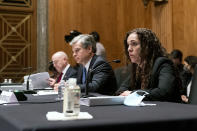 Secretary of Homeland Security Alejandro Mayorkas, left, FBI Director Christopher Wray, center, and Director of the National Counterterrorism Center Christine Abizaid, testify before a Senate Homeland Security and Governmental Affairs Committee hearing to discuss security threats 20 years after the 9/11 terrorist attacks, Tuesday, Sept. 21, 2021 on Capitol Hill in Washington. (Greg Nash/Pool via AP)