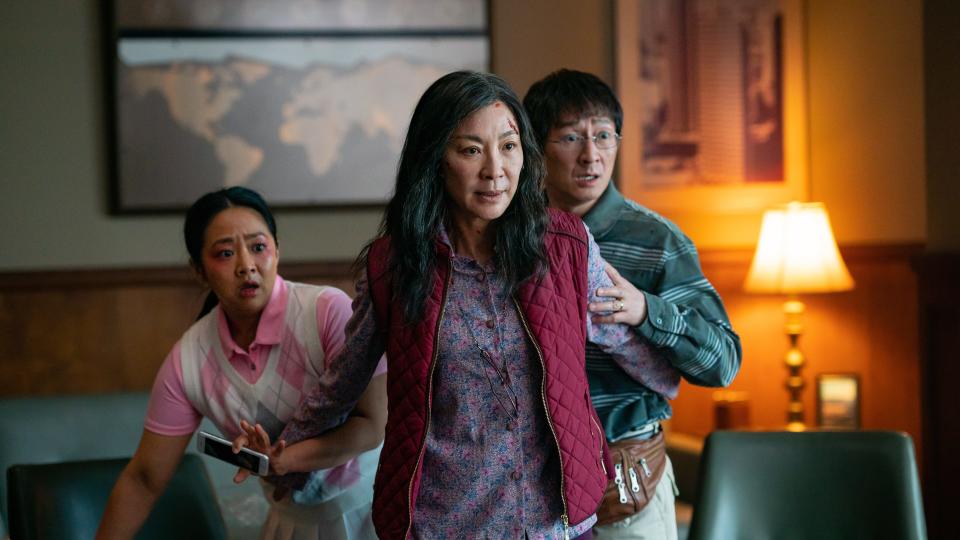 Michelle Yeoh (center) in ‘Everything Everywhere All at Once’ - Credit: A24