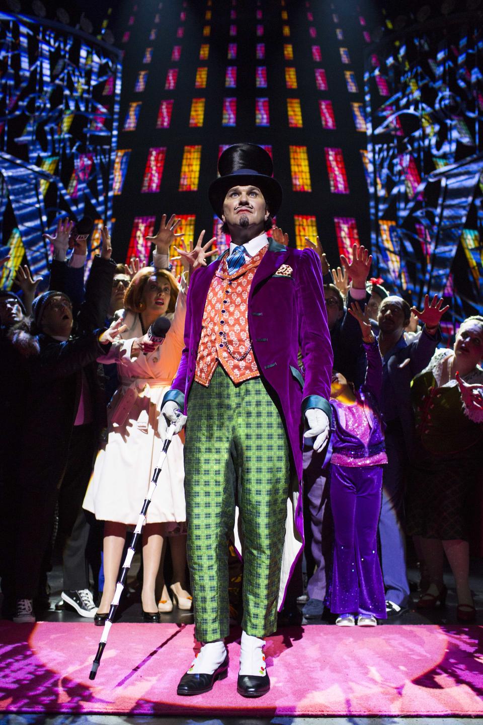 In this undated theater image released by The Corner Shop shows Douglas Hodge as Willy Wonka during a performance of the "Charlie And The Chocolate Factory." The musical, a reinterpretation by Oscar-winning director Sam Mendes, premieres Tuesday, June 25, 2013, at London's Theatre Royal Drury Lane. (AP Photo/The Corner Shop, Helen Maybanks)