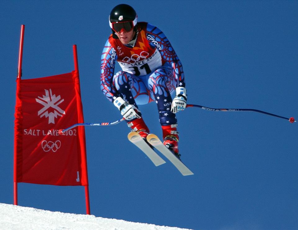 USA’s Marco Sullivan goes airborne as he takes on the muzzleloader jump and skis to a ninth place in the men’s downhill race at the Salt Lake 2002 Winter Olympic Games at Snowbasin on Feb. 10, 2002. Sullivan was the top U.S. finisher. | Johanna Kirk, Deseret News