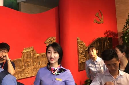 Staff members guide reporters inside the history gallery of the Party School of the Chinese Communist Party (CPC)'s Central Committee during a government organised visit in Beijing