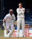 Australian bowler Nathan Lyon (R) watches as West Indies batsman Shivnarine Chanderpaul (L) runs for two during the third day of the second-of-three Test matches between Australia and West Indies April 17, 2012 at Queen's Park Oval in Port of Spain, Trinidad. AFP PHOTO/Stan HONDA (Photo credit should read STAN HONDA/AFP/Getty Images)